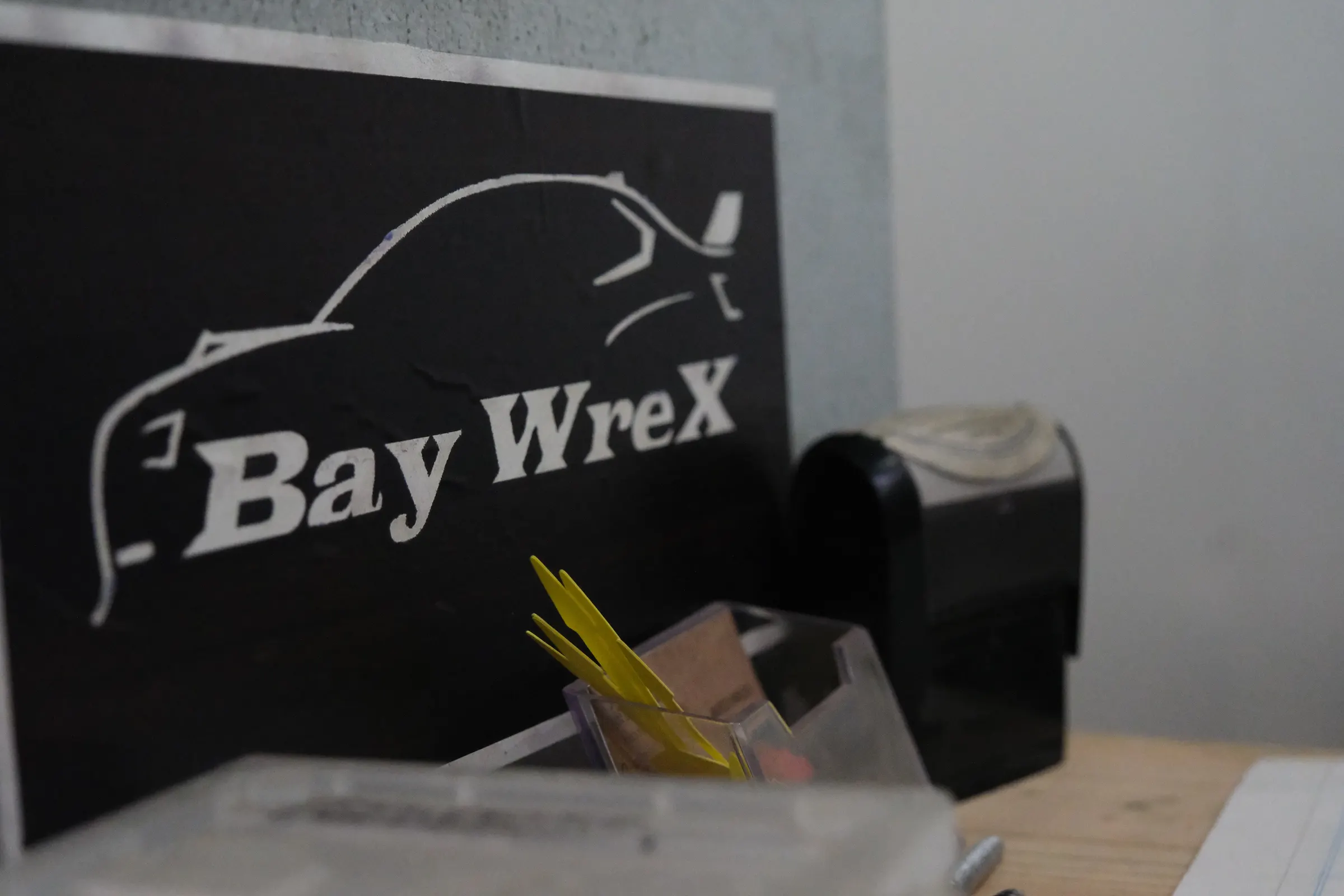 Baywrex sign on the front desk of the Bayswater North workshop